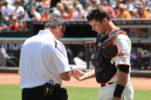 Buster Posey takes one for the team