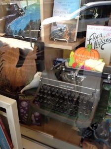A manual typewriter in the window display of Coastal Books in Half Moon Bay, California