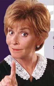 TV's Judge Judy wags her finger in a tsk tsk motio 
