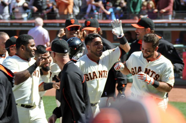 The San Francisco Giants celebrate Brandon Hicks' 3-run walk off home run against the Cleveland Indians. AT&T Park. April 27, 2014.