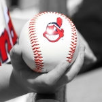 Boy holds Cleveland Indians baseball with Chief Wahoo logo. Cactus League, Scottsdale Arizona. March 16, 2014